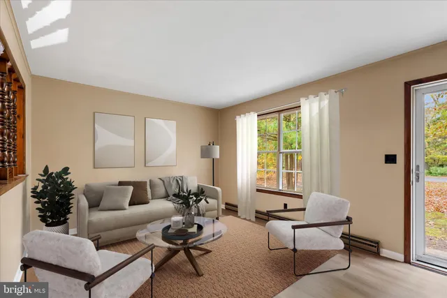 a living room with furniture and a window