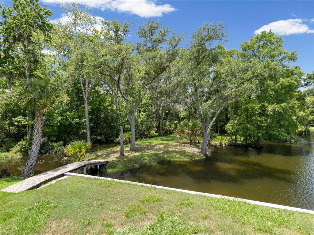 5904 Springrun Court Holiday, FL 34690 - Photo 30 of 53 a view of lake with green space