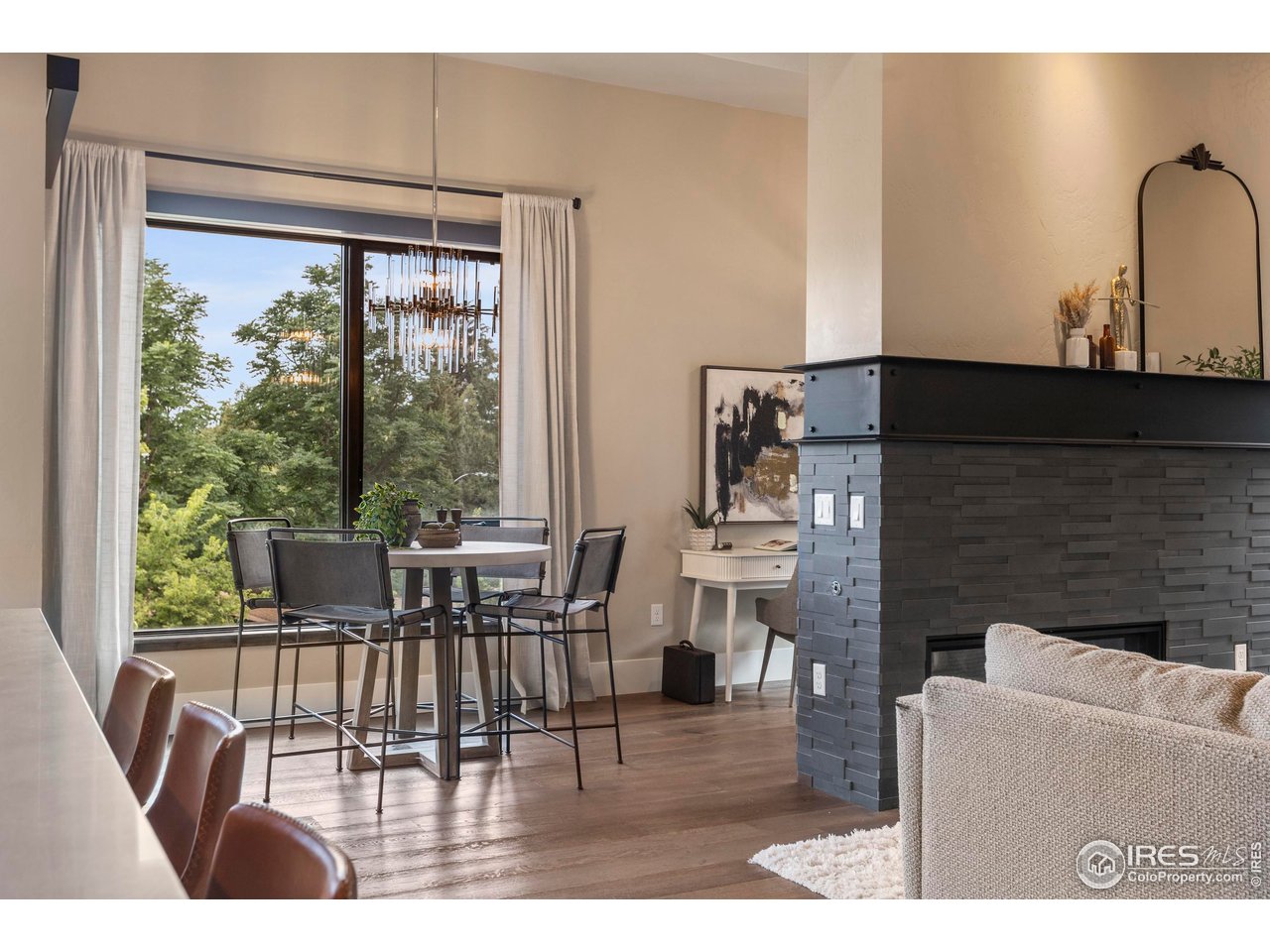 302 North Meldrum Street, Unit 314 Fort Collins, CO 80521 - Photo 20 of 50 a living room with fireplace furniture and a large window