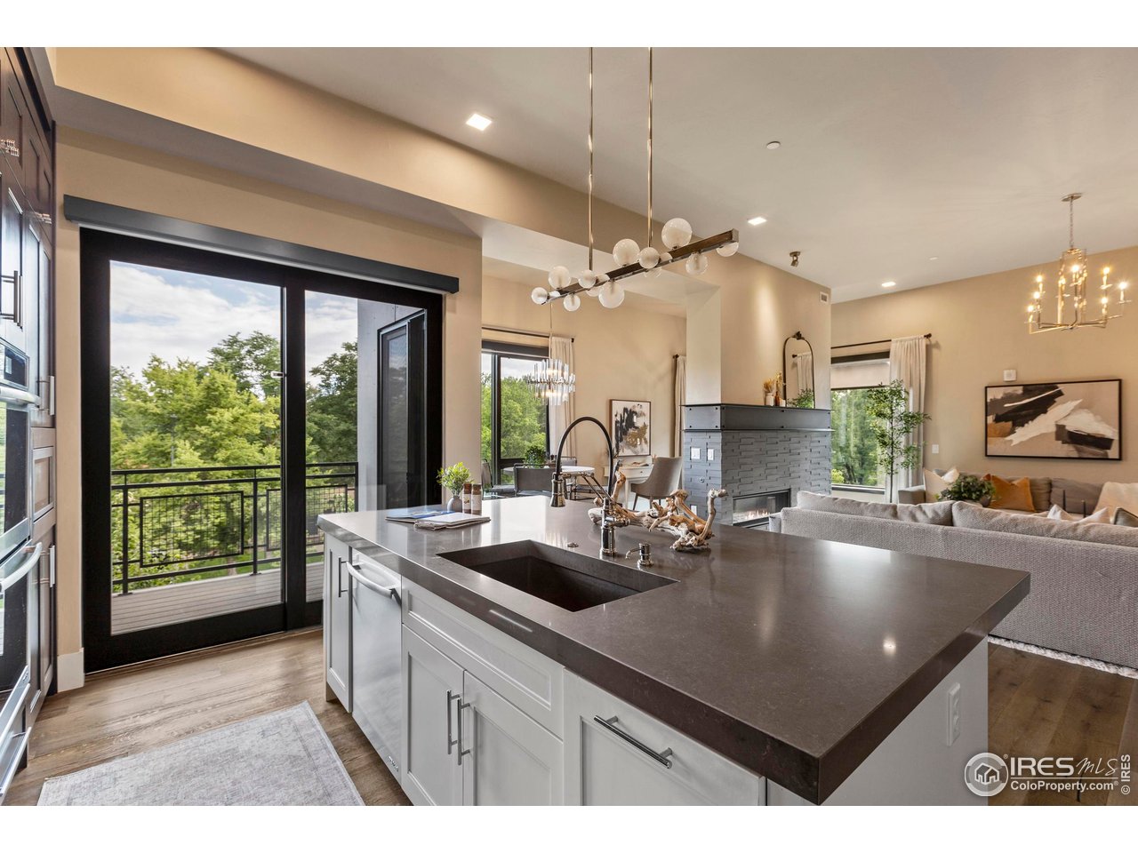 302 North Meldrum Street, Unit 314 Fort Collins, CO 80521 - Photo 22 of 50 a kitchen with counter top space a sink and cabinets