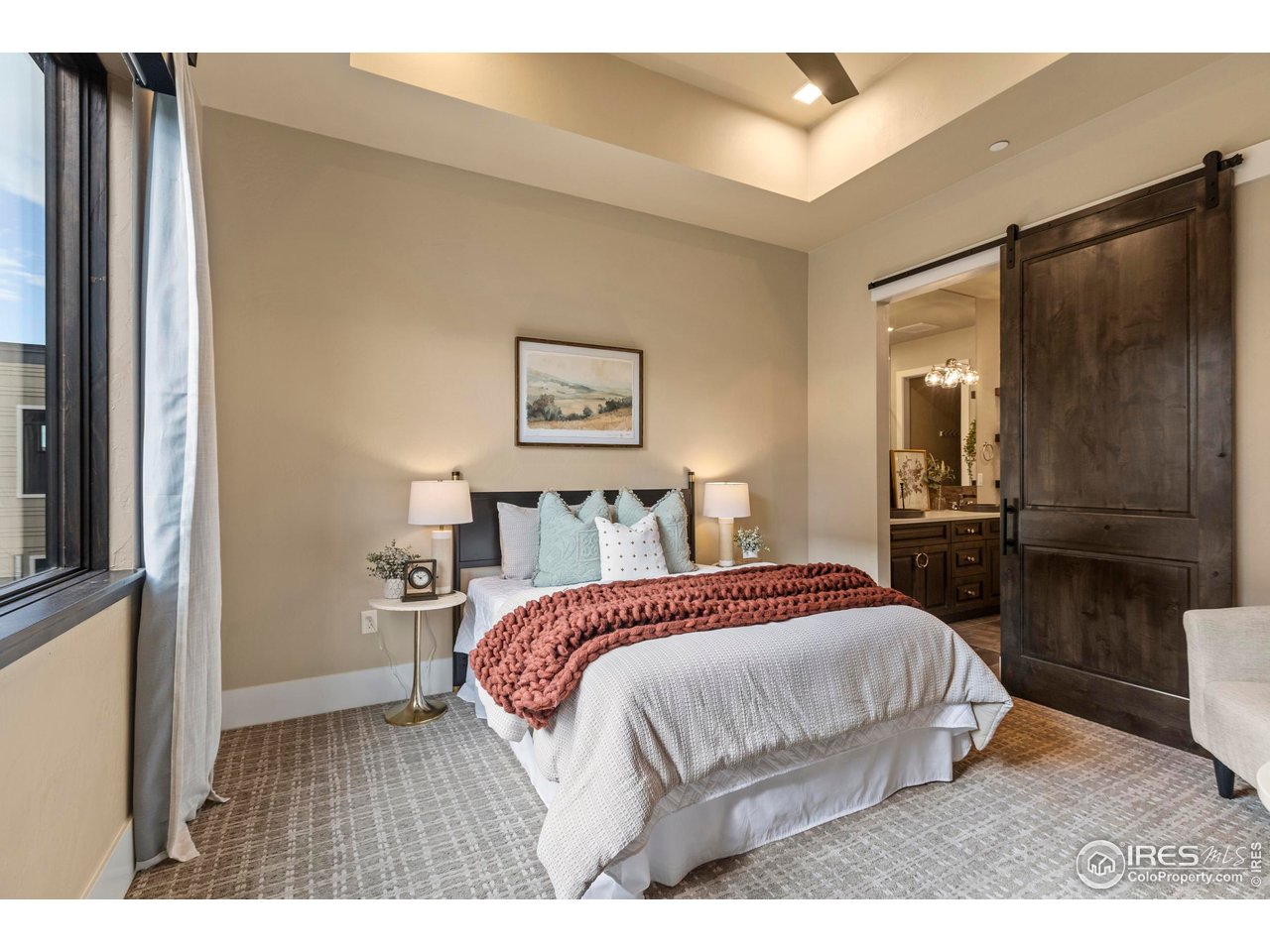 302 North Meldrum Street, Unit 314 Fort Collins, CO 80521 - Photo 29 of 50 a bedroom with a bed and a view of kitchen