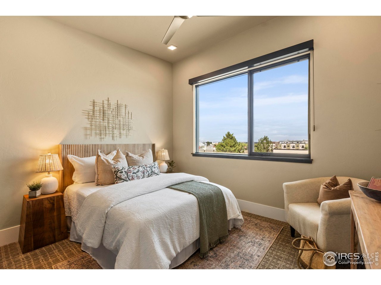302 North Meldrum Street, Unit 314 Fort Collins, CO 80521 - Photo 43 of 50 a bedroom with a bed and a large window