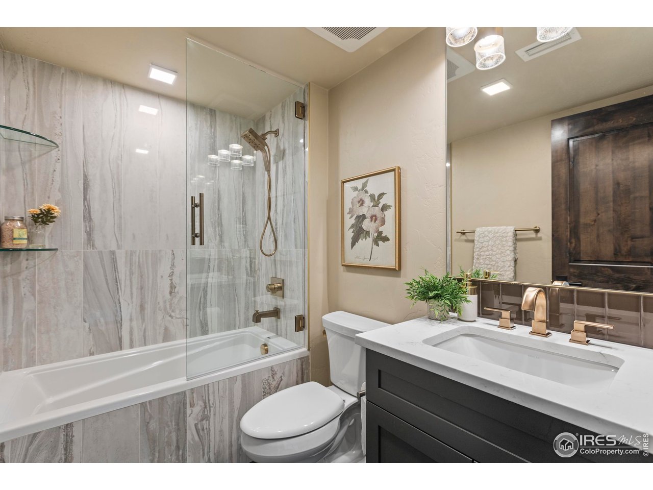 302 North Meldrum Street, Unit 314 Fort Collins, CO 80521 - Photo 44 of 50 a bathroom with a double vanity sink toilet mirror and bathtub