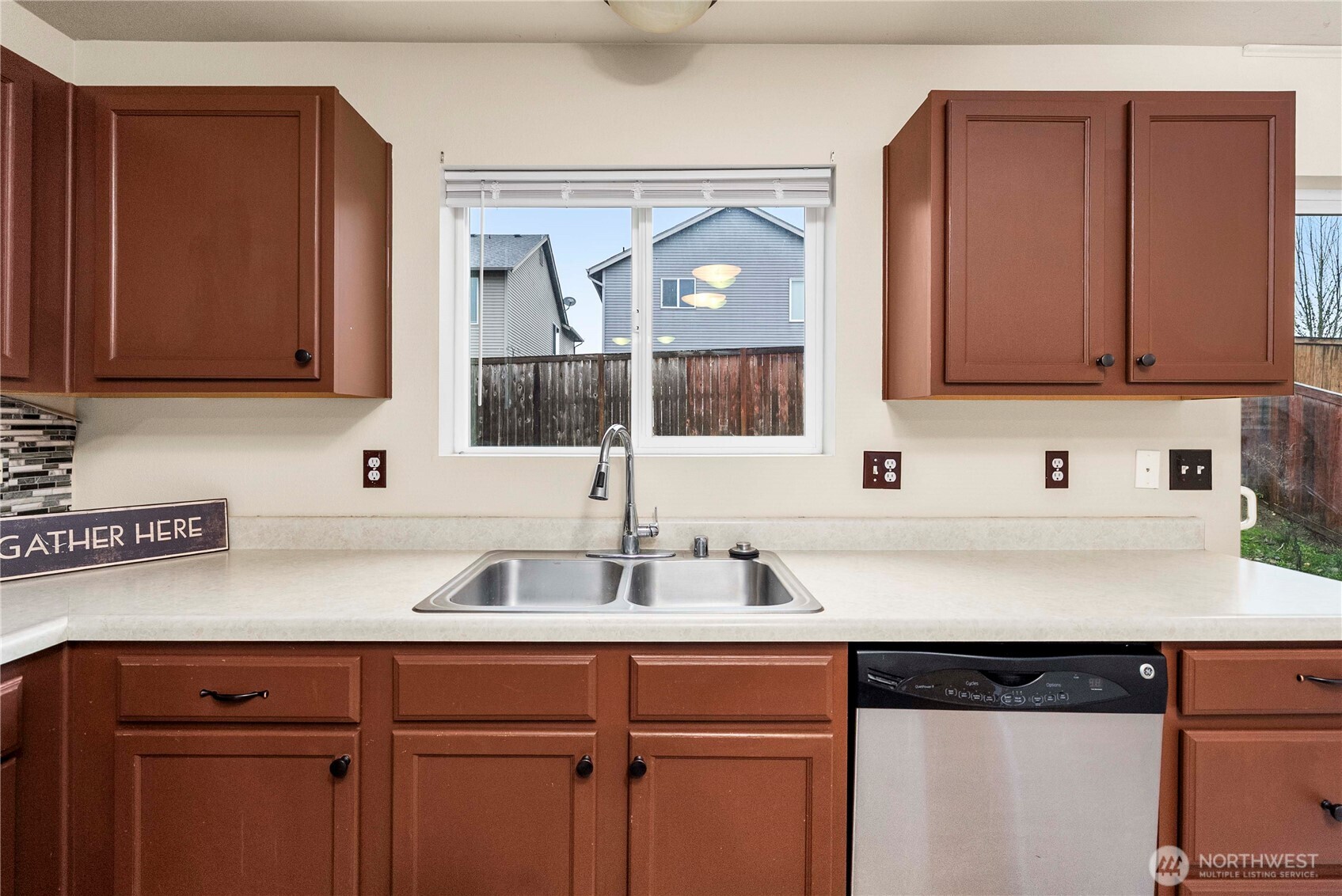 14942 99th Way Southeast Yelm, WA 98597 - Photo 14 of 37 a kitchen with a sink cabinets and a window