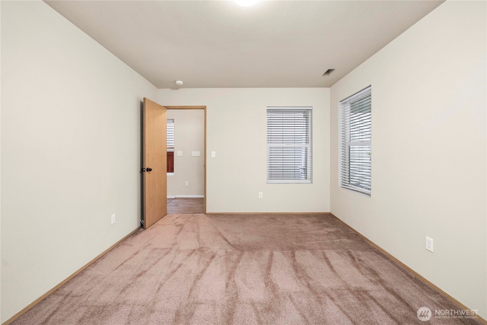 14942 99th Way Southeast Yelm, WA 98597 - Photo 21 of 37 an empty room with windows