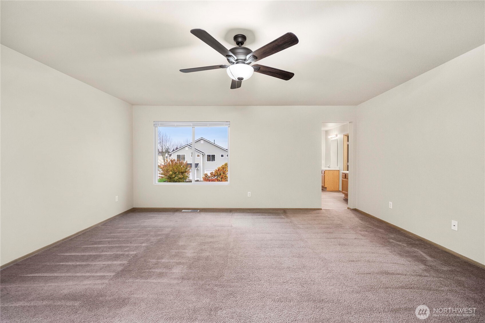 14942 99th Way Southeast Yelm, WA 98597 - Photo 24 of 37 an empty room with window and ceiling fan