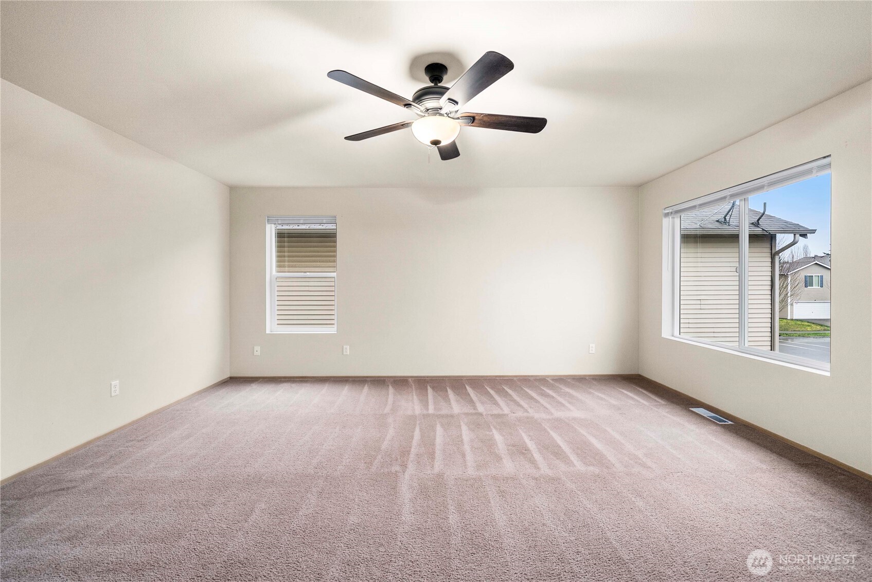 14942 99th Way Southeast Yelm, WA 98597 - Photo 25 of 37 an empty room with window and ceiling fan