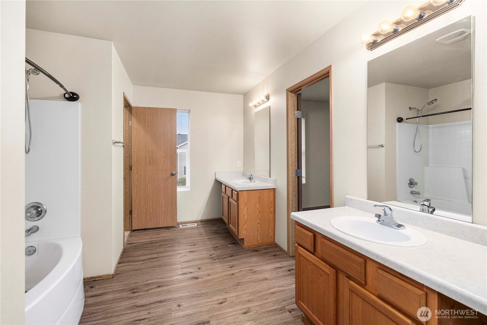 14942 99th Way Southeast Yelm, WA 98597 - Photo 26 of 37 a bathroom with a tub sink and mirror