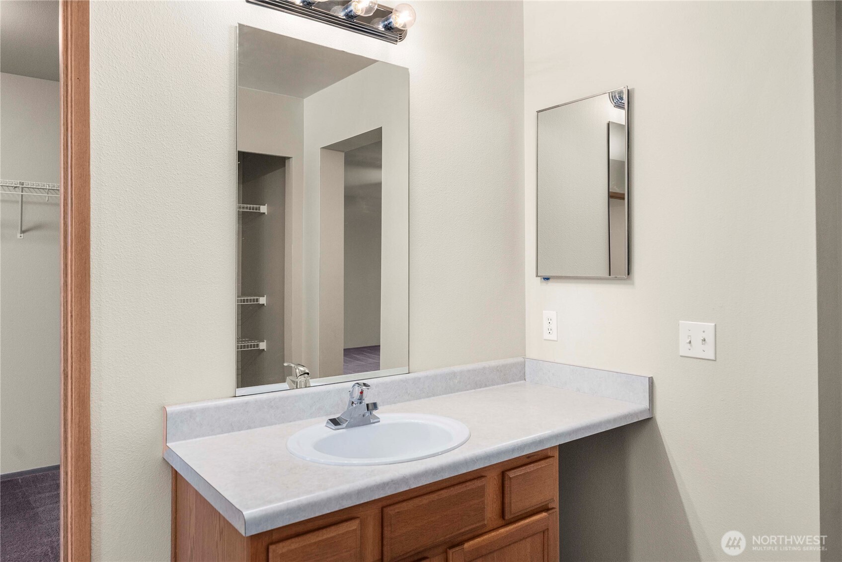 14942 99th Way Southeast Yelm, WA 98597 - Photo 27 of 37 a bathroom with a sink and a mirror