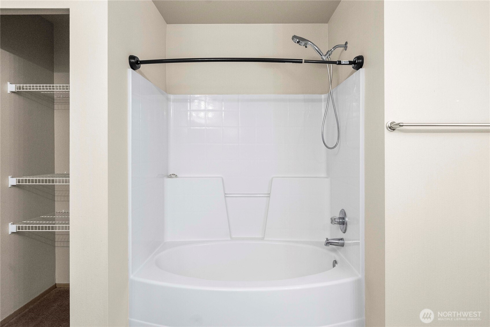 14942 99th Way Southeast Yelm, WA 98597 - Photo 28 of 37 a bathroom with a bathtub and a shower