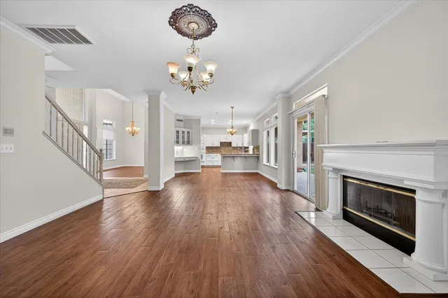 a kitchen with stainless steel appliances granite countertop a sink and wooden cabinets
