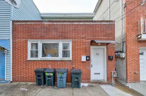 a brick building with a door and a door