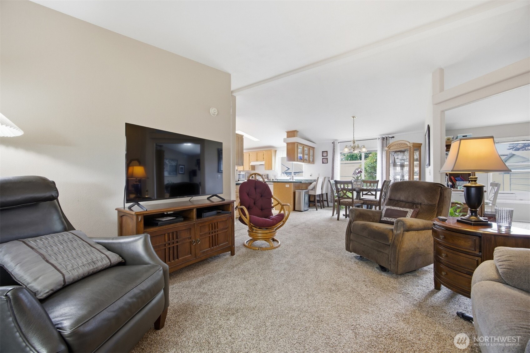 380 East Pole Road, Unit 6 Lynden, WA 98264 - Photo 9 of 40 a living room with furniture and a flat screen tv