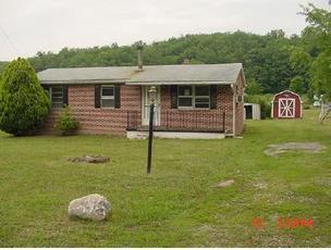 240 Brake Road Elliston, VA 24087 - Photo 1 of 1 a view of a house with backyard and garden