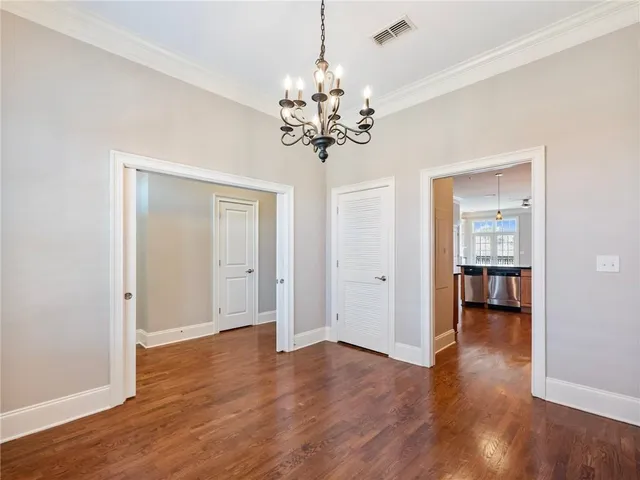a kitchen with granite countertop a sink and cabinets