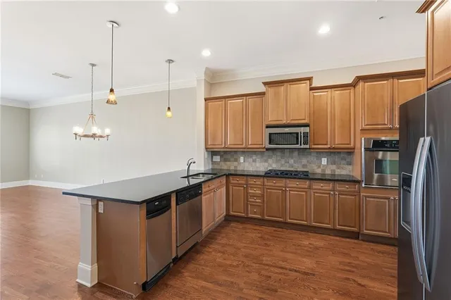 a view of an empty room with a fireplace and a window