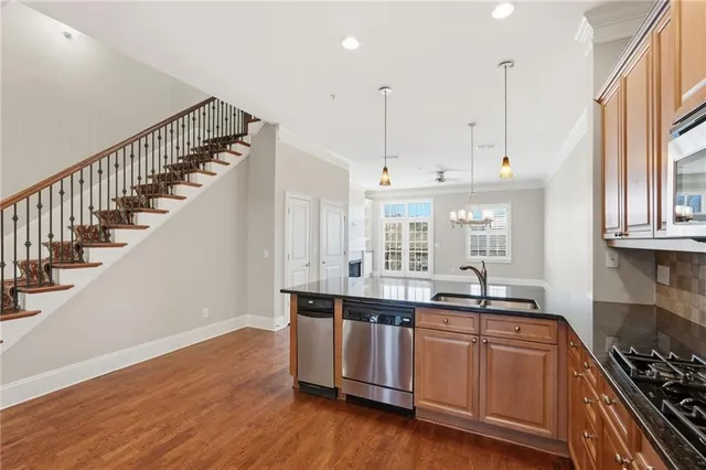 a view of a livingroom with fireplace wooden floor and windows