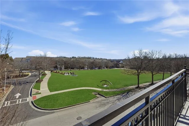 a view of a room with a window and a ceiling fan