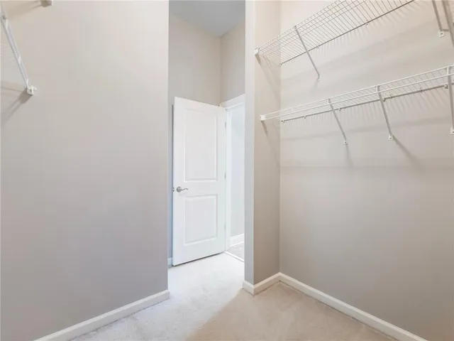a view of an empty walk in closet