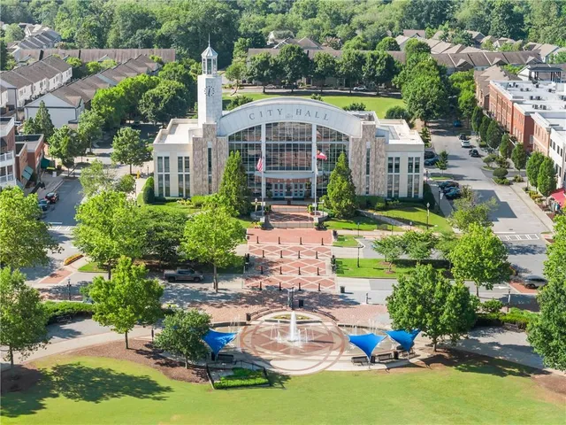 a front view of a building with retail shops