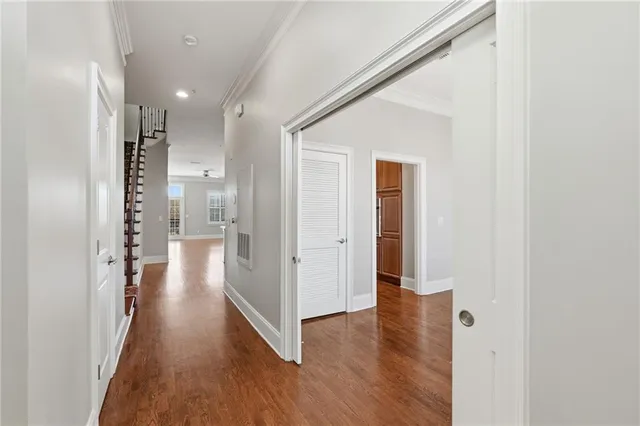 a view of entryway and hall with wooden floor