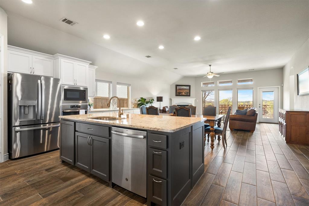 1647 Twistleaf Road Northlake, TX 76226 - Photo 14 of 39 a kitchen with lots of counter top space and stainless steel appliances