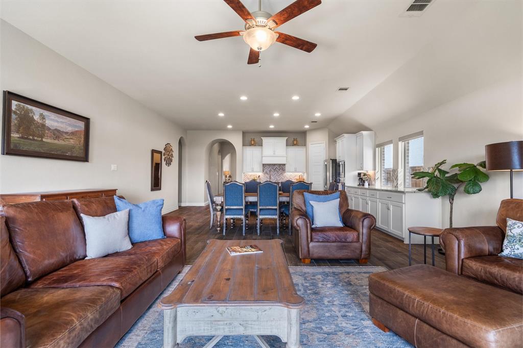 1647 Twistleaf Road Northlake, TX 76226 - Photo 18 of 39 a living room with furniture and a chandelier