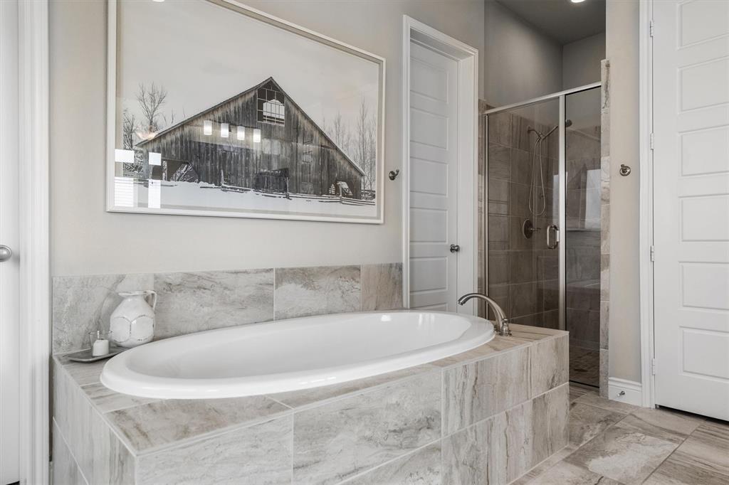 1647 Twistleaf Road Northlake, TX 76226 - Photo 22 of 39 a bath tub sitting next to a shower and a sink