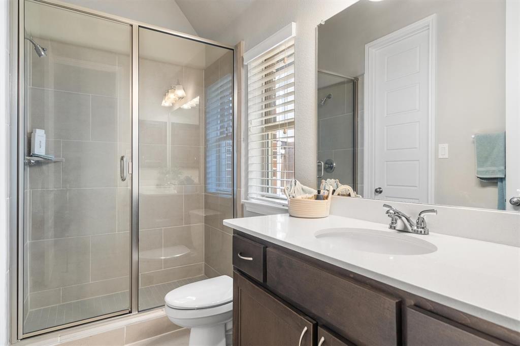 1647 Twistleaf Road Northlake, TX 76226 - Photo 27 of 39 a bathroom with a sink a toilet and shower