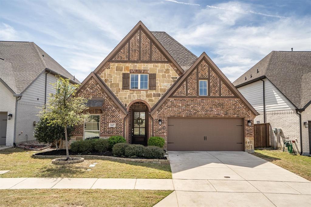 1647 Twistleaf Road Northlake, TX 76226 - Photo 3 of 39 a front view of a house with garden