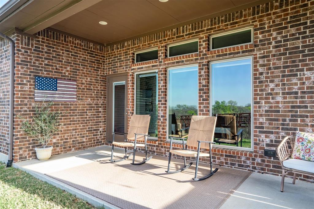 1647 Twistleaf Road Northlake, TX 76226 - Photo 31 of 39 a view of a patio with a table and chairs and potted plants