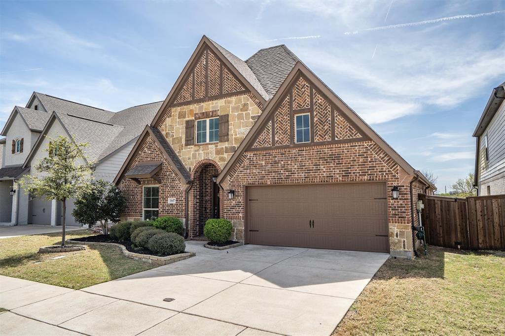 1647 Twistleaf Road Northlake, TX 76226 - Photo 5 of 39 a front view of a house with a yard and garage