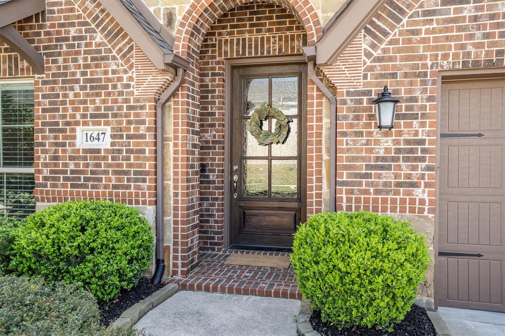 1647 Twistleaf Road Northlake, TX 76226 - Photo 6 of 39 a view of a brick house with a large windows