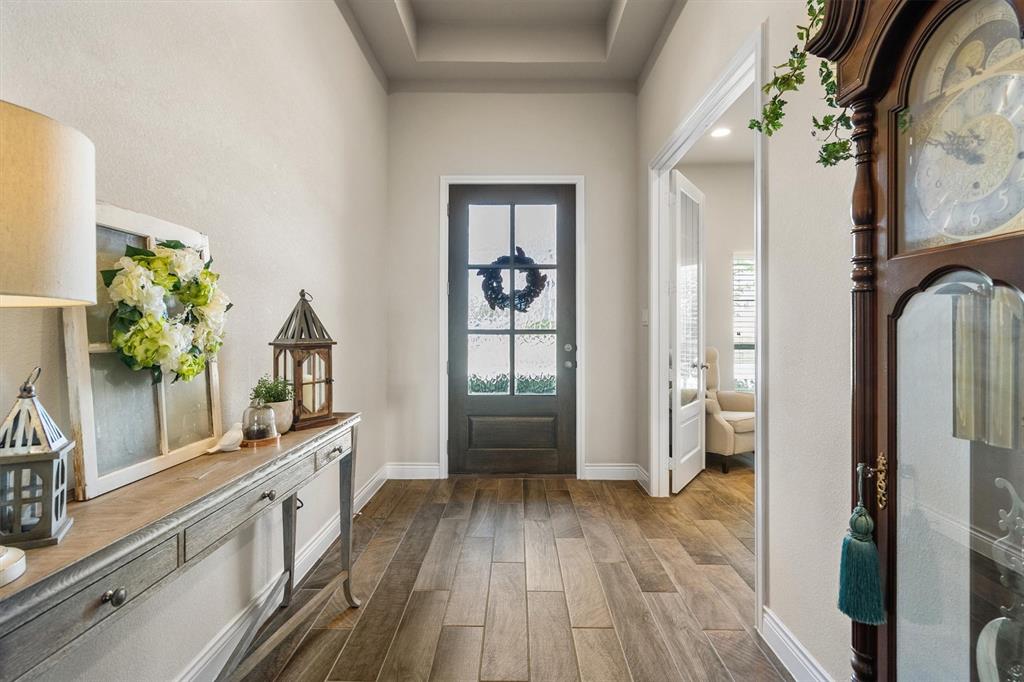 1647 Twistleaf Road Northlake, TX 76226 - Photo 7 of 39 a view of a hallway view with wooden floor and staircase