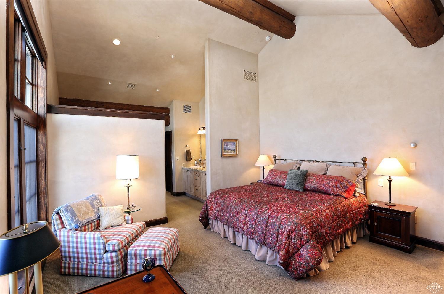 3508 Daybreak Ridge Road Avon, CO 81620 - Photo 13 of 25 a bedroom with a bed and a couch