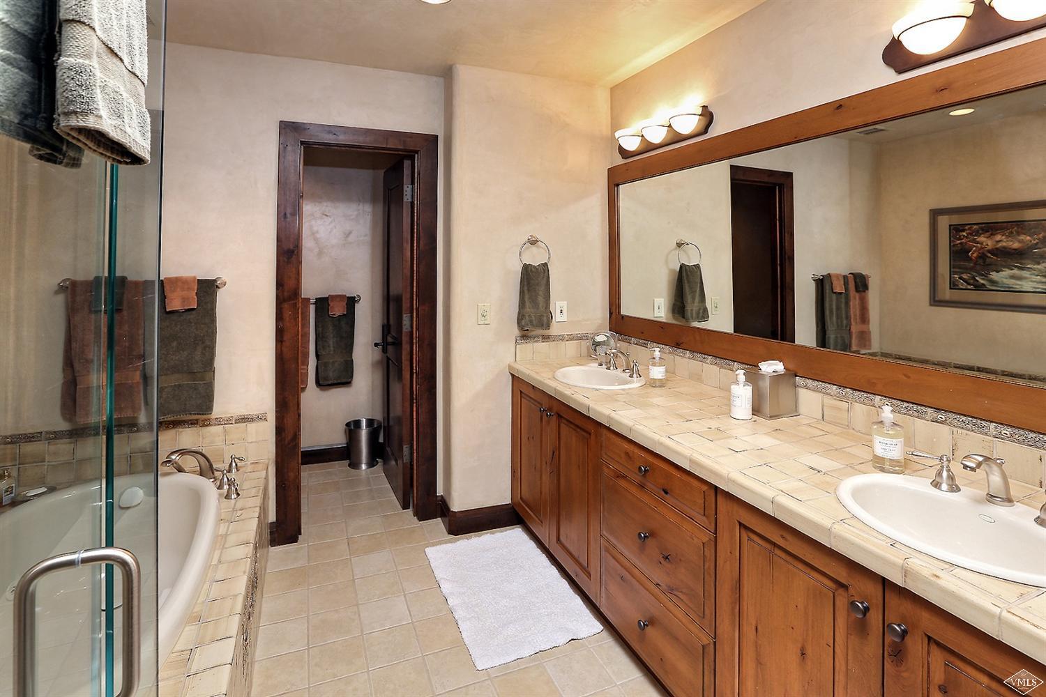 3508 Daybreak Ridge Road Avon, CO 81620 - Photo 16 of 25 a spacious bathroom with a double vanity sink mirror and double