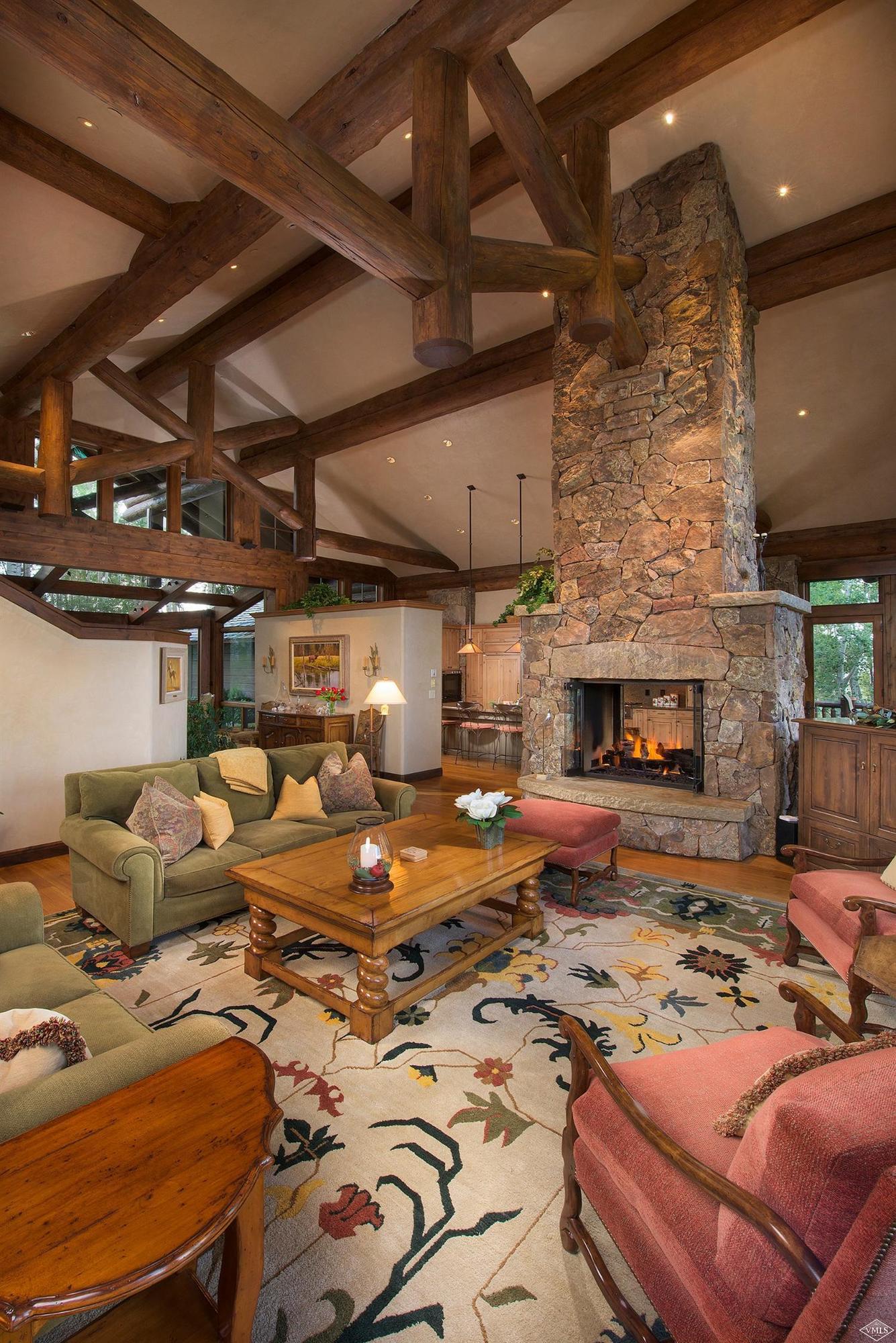 3508 Daybreak Ridge Road Avon, CO 81620 - Photo 7 of 25 a living room with furniture and a fireplace