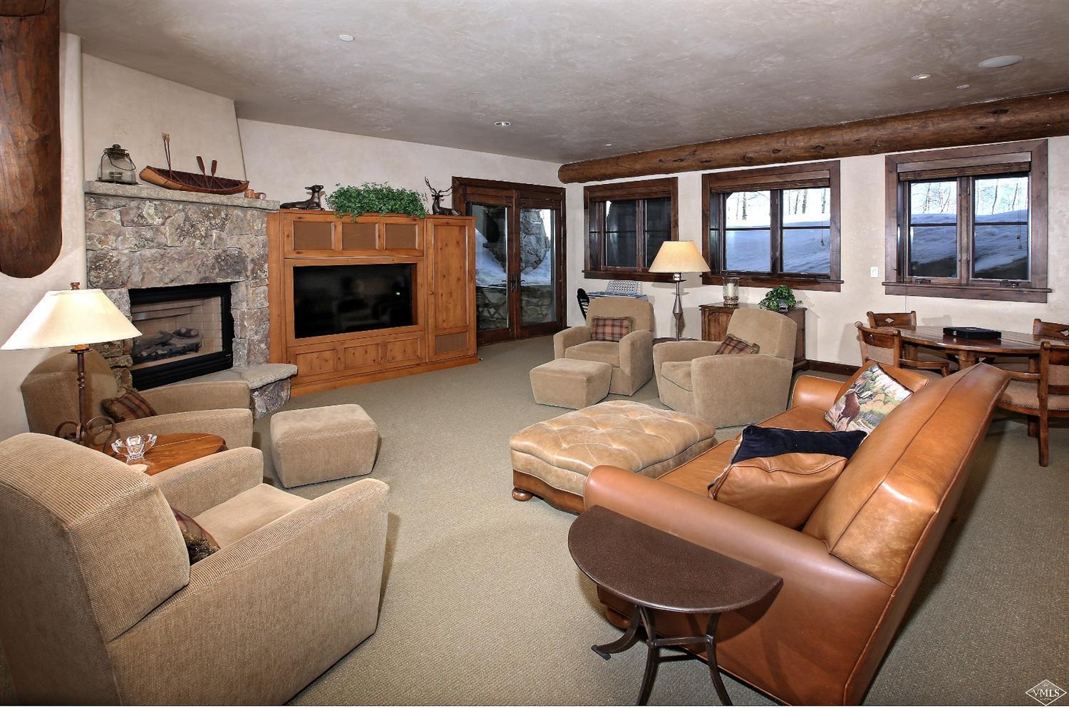 3508 Daybreak Ridge Road Avon, CO 81620 - Photo 9 of 25 a living room with furniture fireplace and a large window