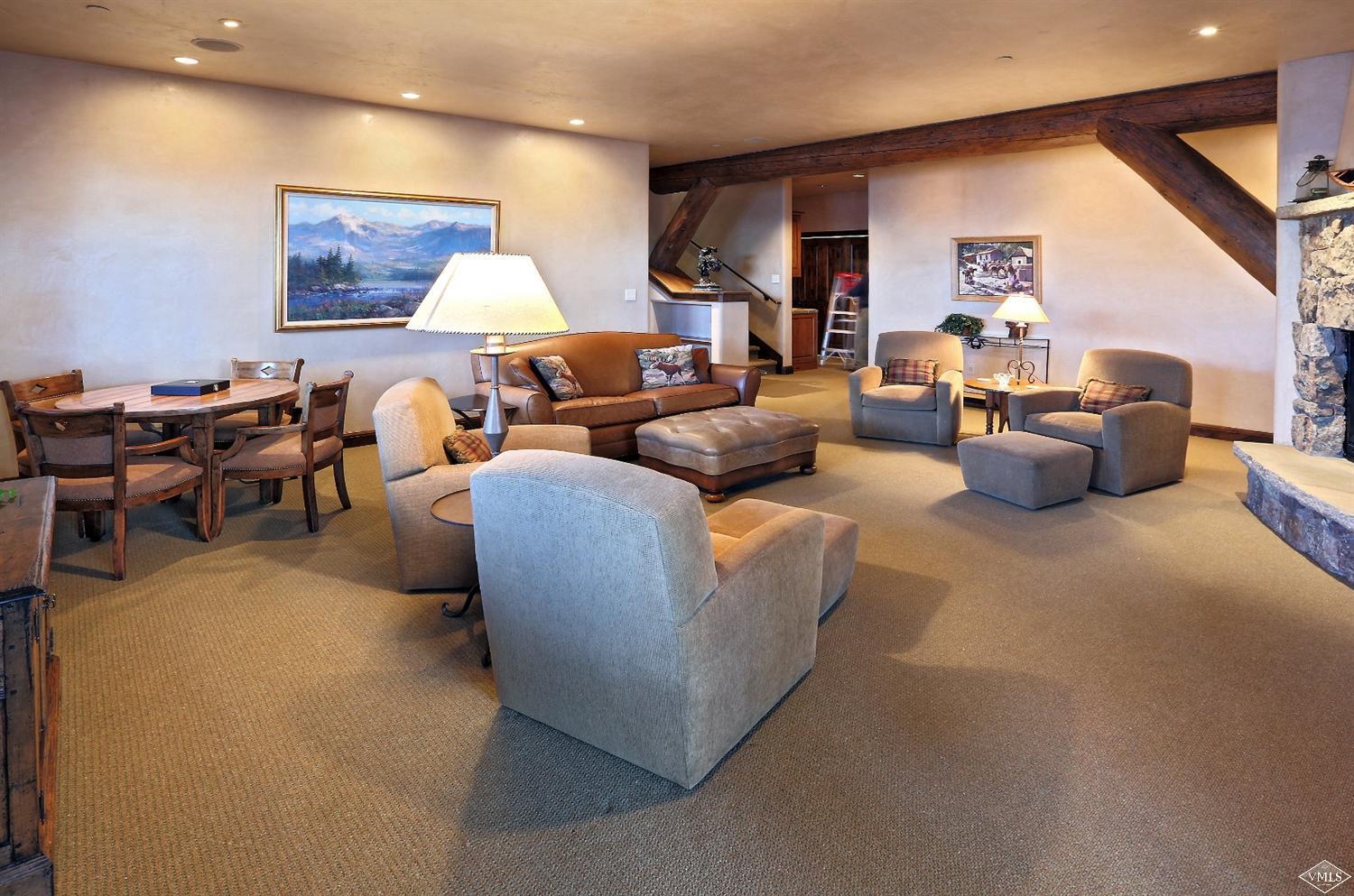 3508 Daybreak Ridge Road Avon, CO 81620 - Photo 10 of 25 a living room with furniture and a lamp
