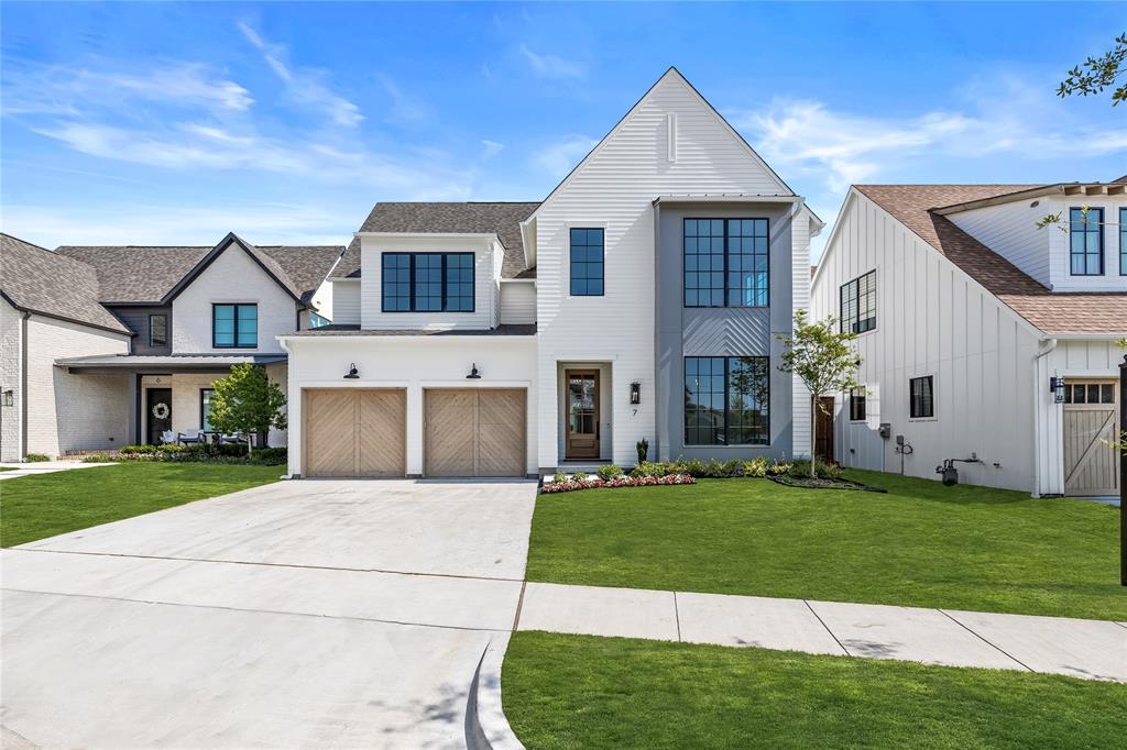 7 Mimosa Place Richardson, TX 75080 - Photo 1 of 1 a front view of a house with a yard and garage