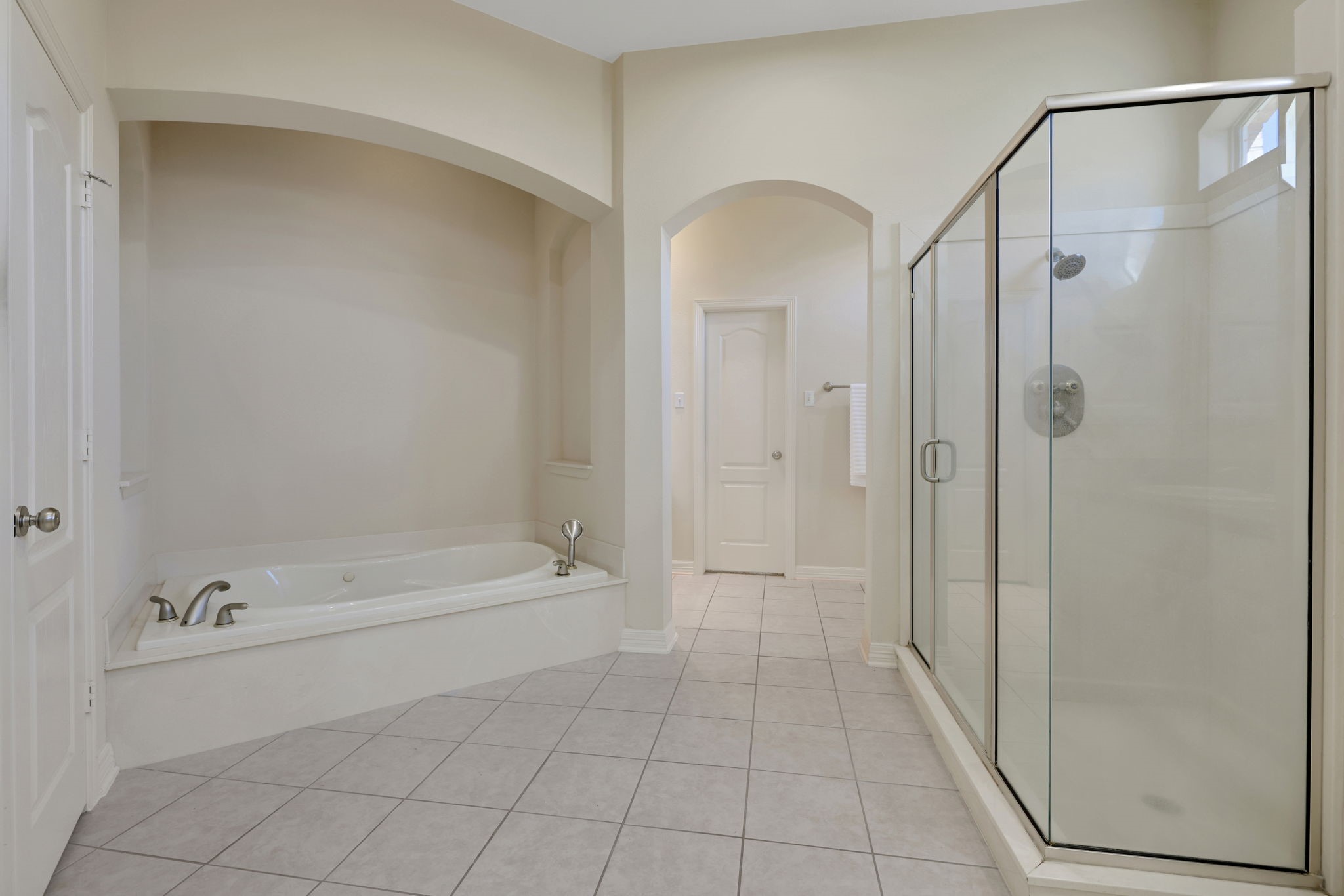 20810 East Cameron Ridge Drive Cypress, TX 77433 - Photo 20 of 48 a bathroom with a bathtub and a shower