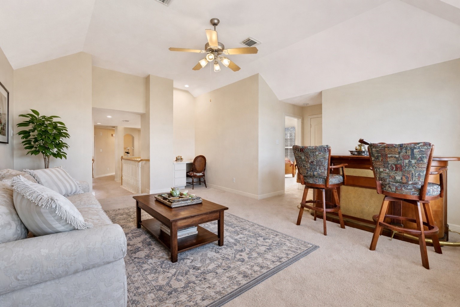 20810 East Cameron Ridge Drive Cypress, TX 77433 - Photo 23 of 48 a living room with furniture and a chandelier