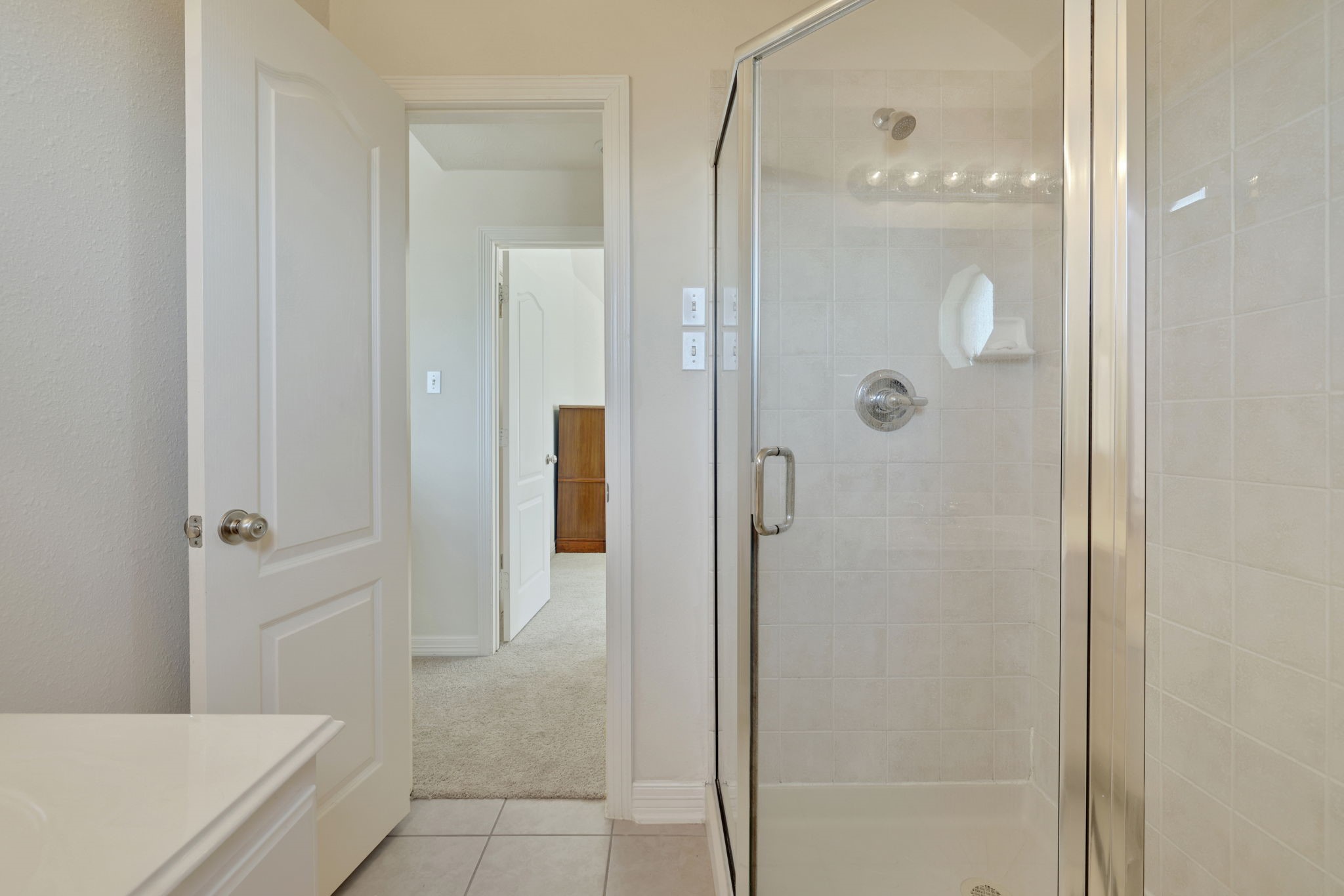 20810 East Cameron Ridge Drive Cypress, TX 77433 - Photo 32 of 48 a bathroom with a glass shower door