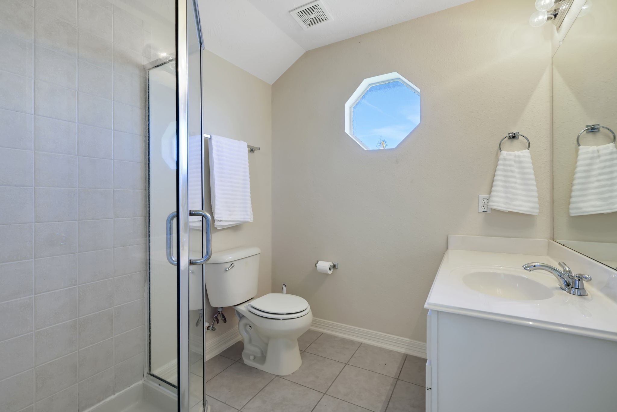 20810 East Cameron Ridge Drive Cypress, TX 77433 - Photo 33 of 48 a bathroom with a toilet a sink and mirror