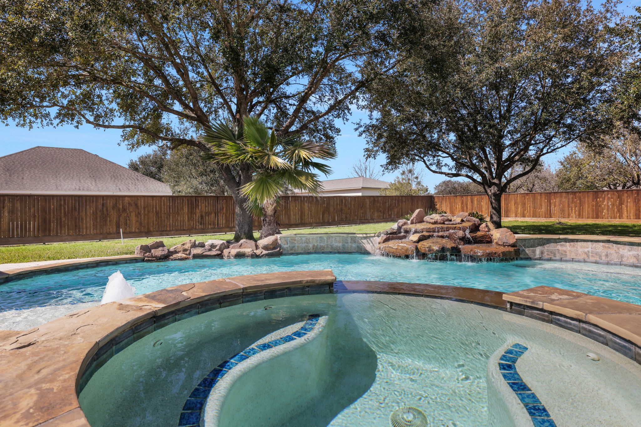 20810 East Cameron Ridge Drive Cypress, TX 77433 - Photo 38 of 48 a swimming pool with outdoor seating and yard