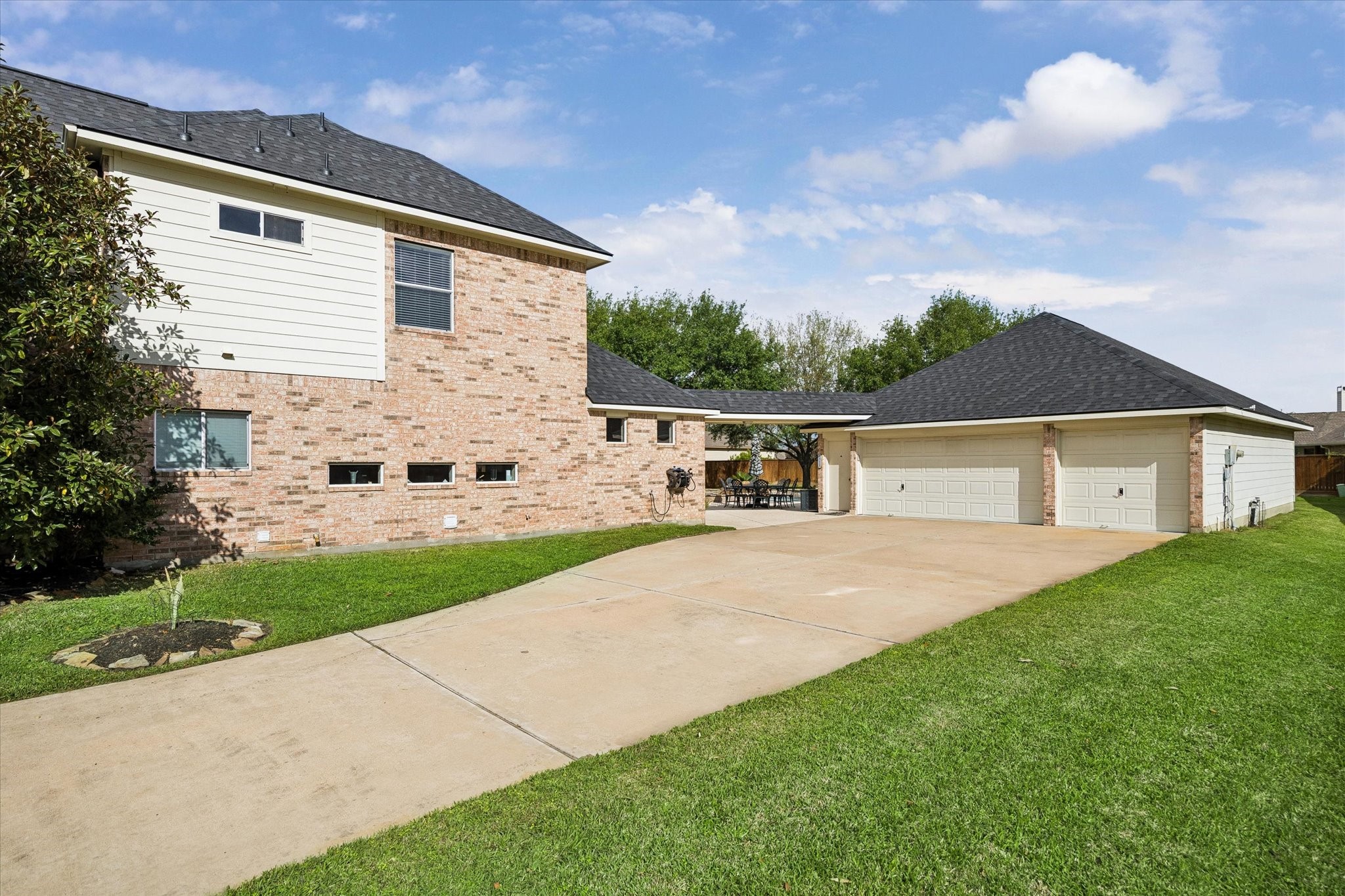 20810 East Cameron Ridge Drive Cypress, TX 77433 - Photo 47 of 48 a view of a white house next to a yard with big trees