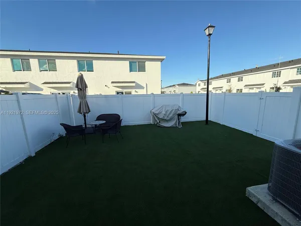 a view of a backyard with plants