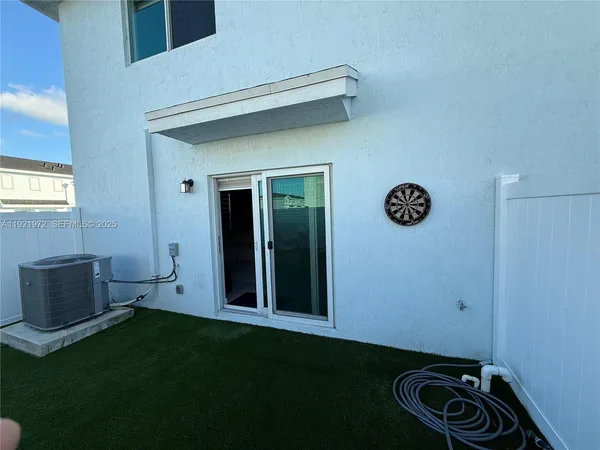 a view of a storage & utility room with a window