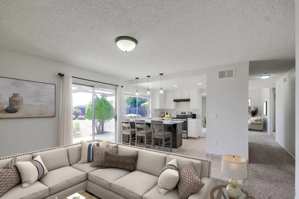 11138 Del Rio Road Spring Valley, CA 91978 - Photo 3 of 23 a living room with furniture and a large window
