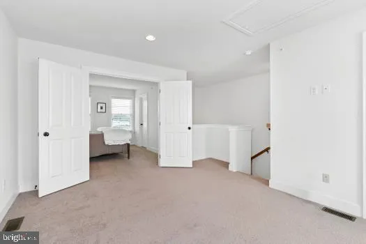 a view of a room with white walls